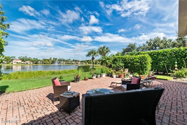 view of patio / terrace featuring outdoor lounge area and a water view