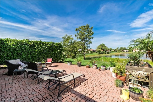 view of patio with a water view