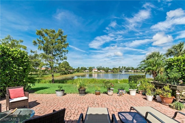 view of patio featuring a water view