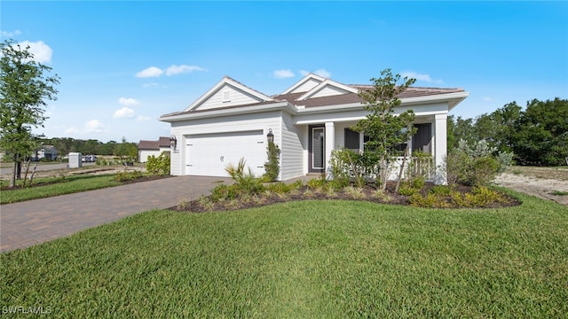 view of front of home with a garage and a front yard