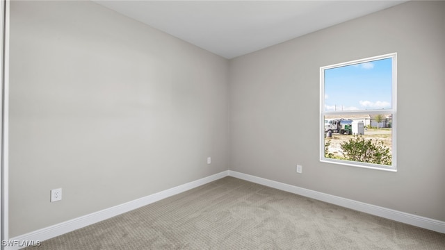 empty room with light colored carpet