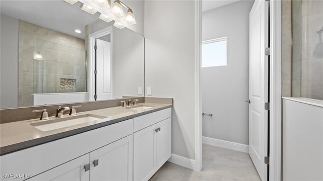 bathroom with dual vanity and tile patterned flooring