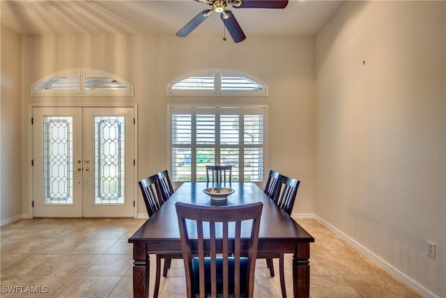 dining space featuring light tile patterned floors, ceiling fan, baseboards, and french doors