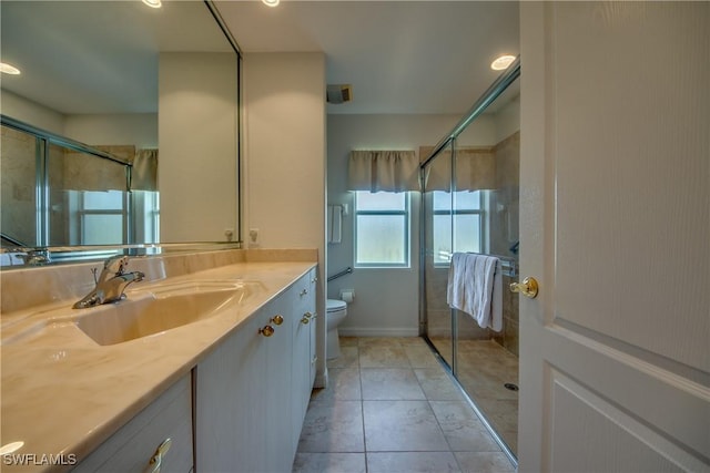 full bath featuring a shower stall, vanity, and toilet