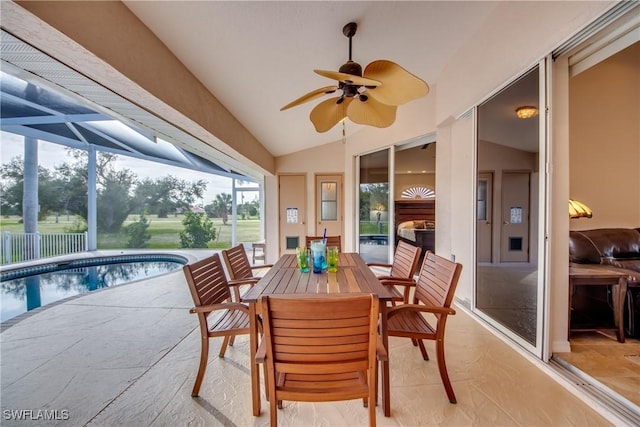 sunroom with lofted ceiling and ceiling fan