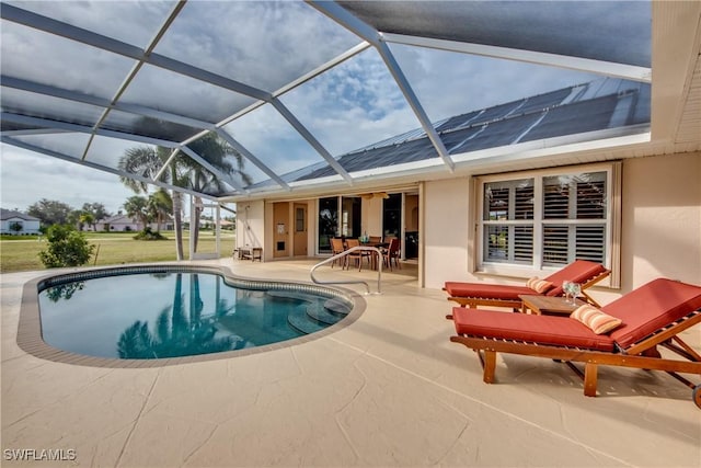 outdoor pool with a lanai, a patio, and outdoor dining area