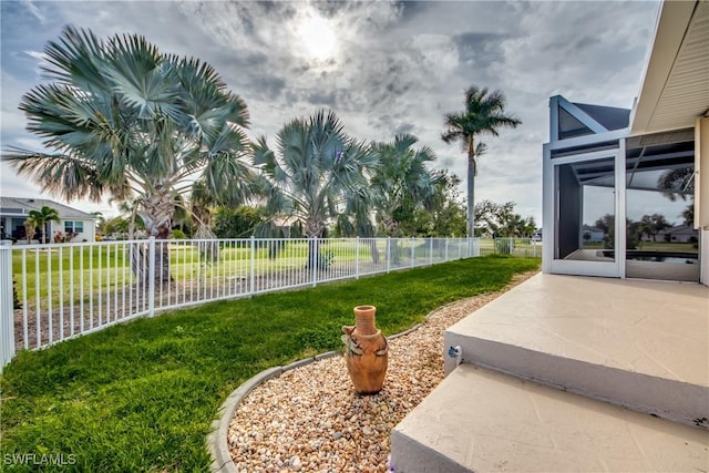 view of yard with a fenced backyard and a patio