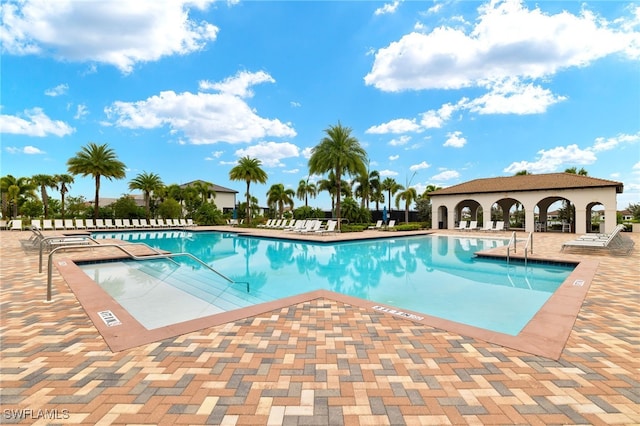 view of swimming pool with a patio