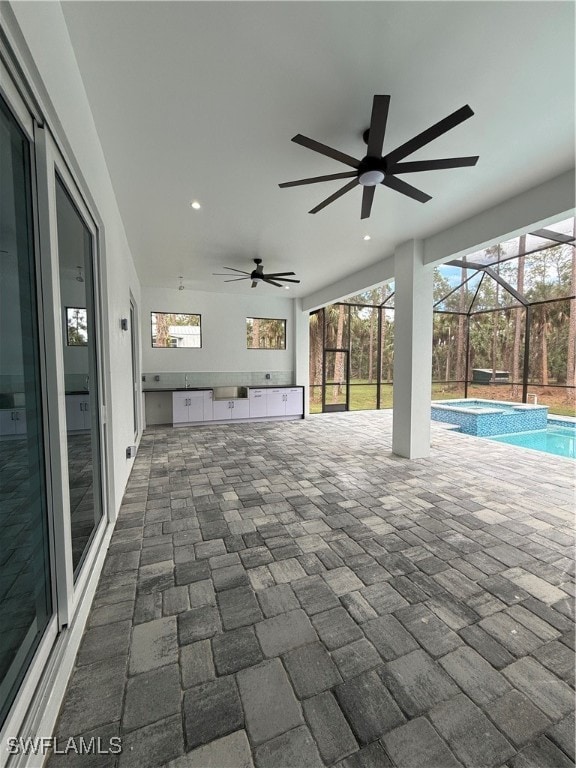 view of patio with a lanai