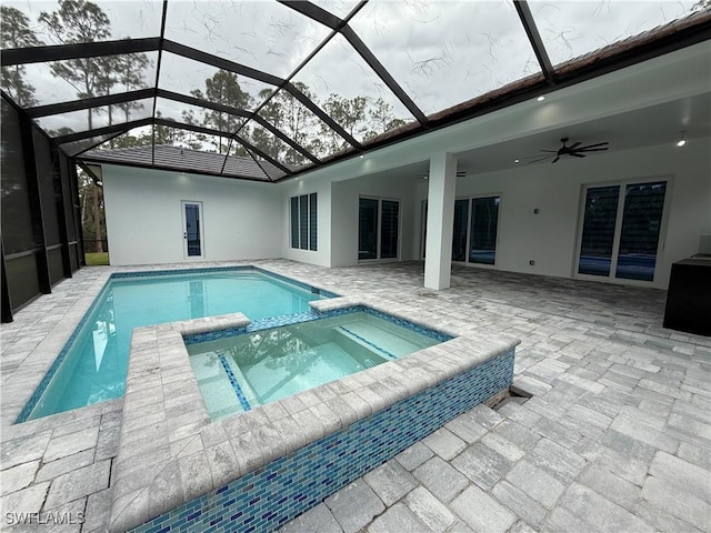 788 9th St SW, Naples, FL 34117 - view of pool with ceiling fan, a patio area, a pool with connected hot tub, and a lanai