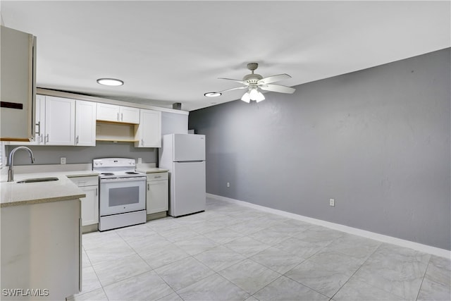 kitchen featuring sink, light tile patterned flooring, white cabinetry, and white appliances