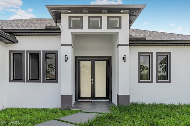 property entrance featuring french doors