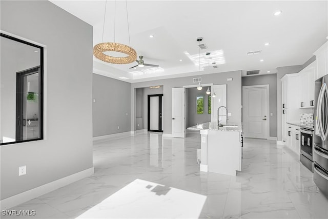 1220 Edison Ave, Lehigh Acres, FL 33972 - interior space with baseboards, recessed lighting, marble finish floor, white cabinetry, and a sink