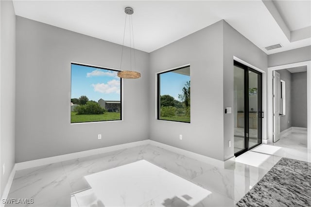 1220 Edison Ave, Lehigh Acres, FL 33972 - unfurnished room with visible vents, baseboards, and marble finish floor