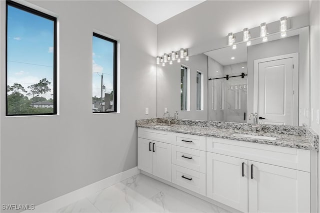 1220 Edison Ave, Lehigh Acres, FL 33972 - bathroom featuring a sink, baseboards, marble finish floor, and a stall shower