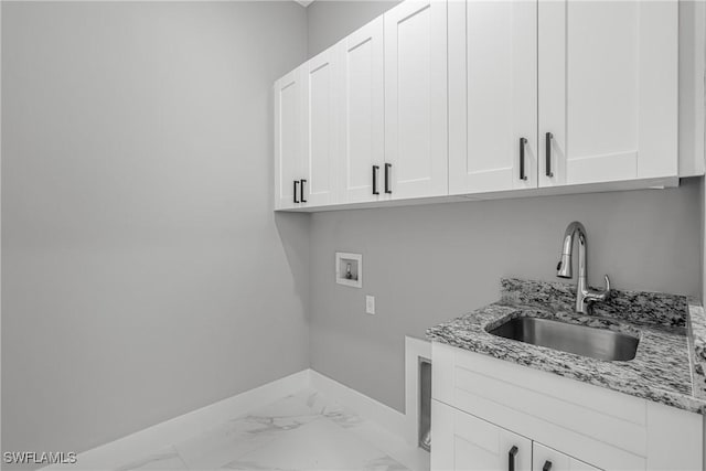 1220 Edison Ave, Lehigh Acres, FL 33972 - laundry room with baseboards, hookup for a washing machine, cabinet space, marble finish floor, and a sink