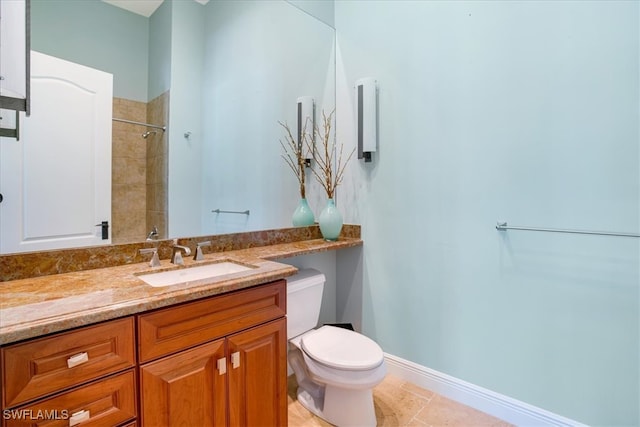 bathroom with tile patterned floors, vanity, and toilet