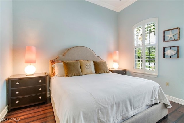 bedroom with crown molding, dark hardwood / wood-style flooring, and multiple windows