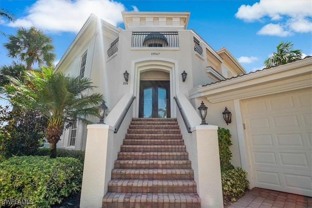 view of front of house with french doors and a garage