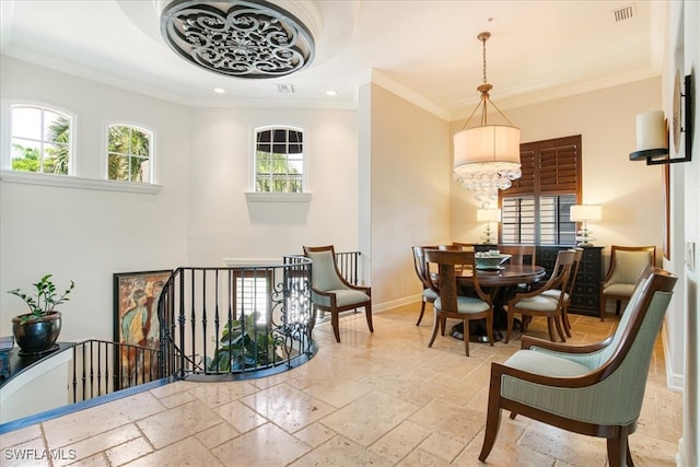 dining area featuring a notable chandelier, light tile patterned floors, and crown molding