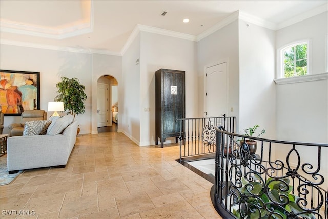 corridor with ornamental molding and tile patterned flooring