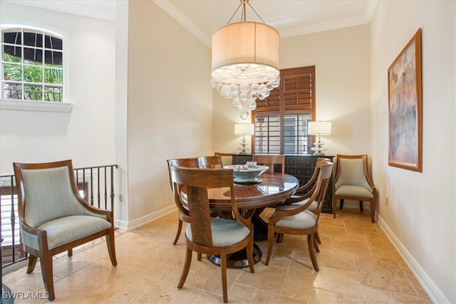 dining room with ornamental molding and light tile patterned floors