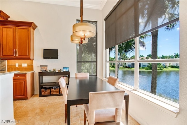 tiled dining space with crown molding