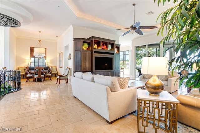 living room featuring ceiling fan, crown molding, and light tile patterned floors