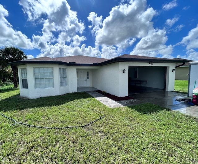 view of front of property with a front lawn and a garage