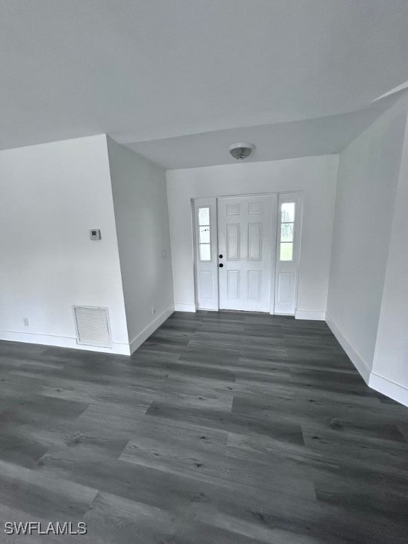 foyer entrance with dark hardwood / wood-style flooring