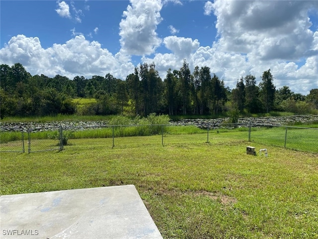 view of yard with a rural view and a patio