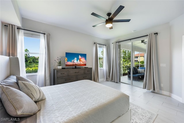 tiled bedroom with ceiling fan, multiple windows, and access to exterior