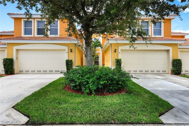 mediterranean / spanish-style home with a garage