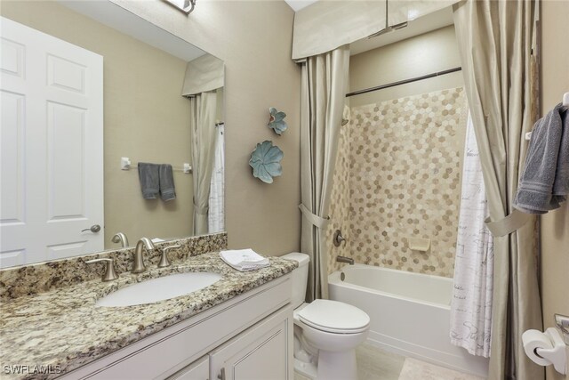 full bathroom featuring tile patterned floors, shower / bath combo, vanity, and toilet