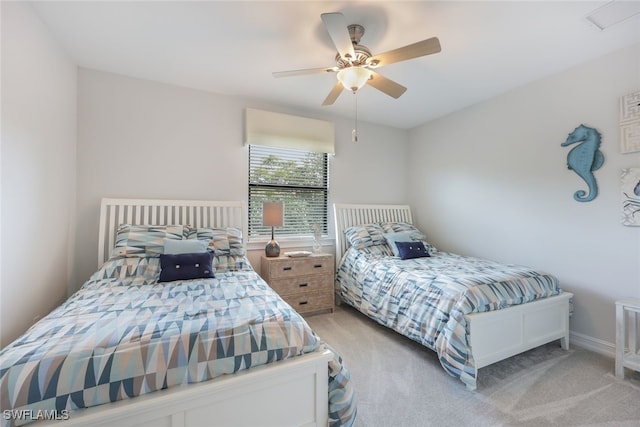 bedroom with light carpet and ceiling fan