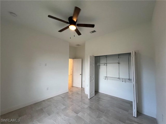 unfurnished bedroom featuring a closet, visible vents, a ceiling fan, and baseboards