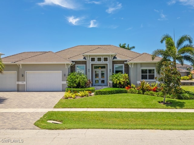 view of front facade featuring a garage and a front yard