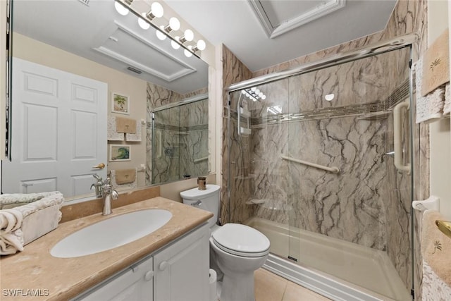 bathroom featuring a marble finish shower, toilet, visible vents, and vanity