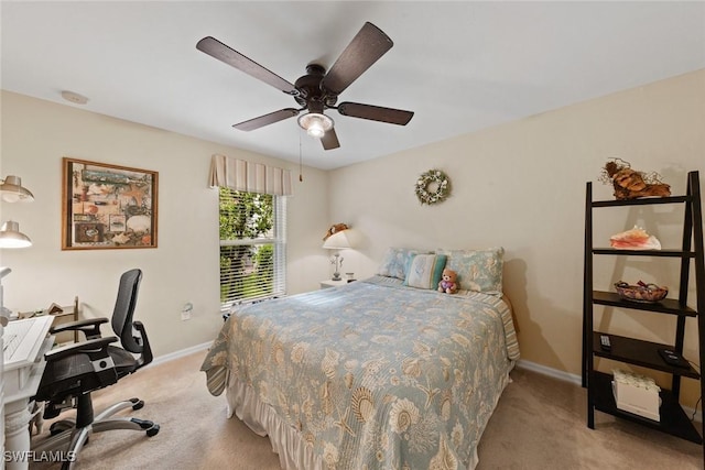 bedroom featuring light carpet and ceiling fan