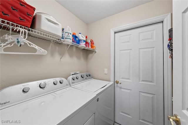 laundry area with separate washer and dryer