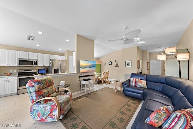 living area with visible vents, a ceiling fan, recessed lighting, light tile patterned floors, and vaulted ceiling