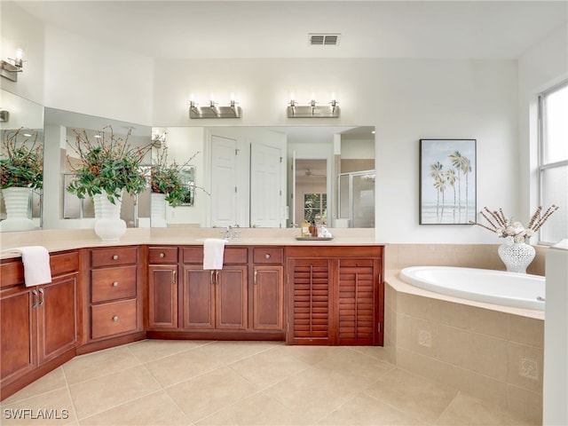 bathroom featuring separate shower and tub, tile patterned floors, and vanity