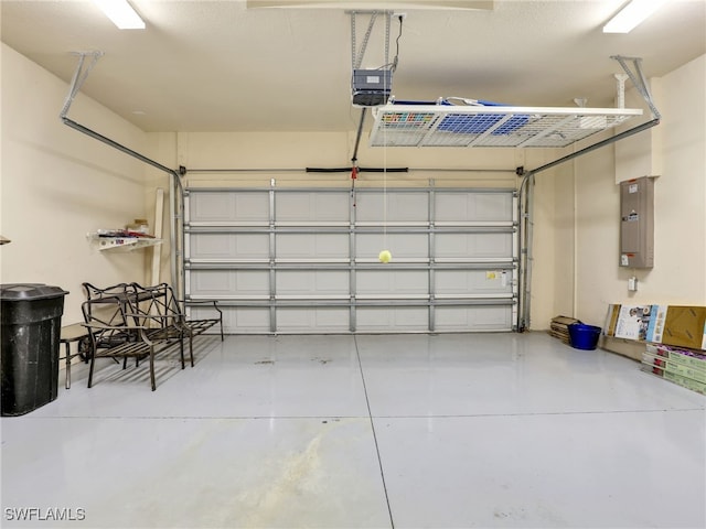 garage with electric panel and a garage door opener