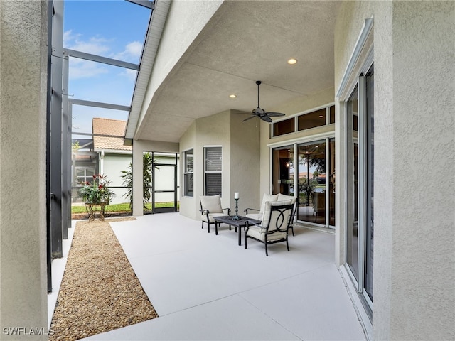 view of patio with a lanai and ceiling fan