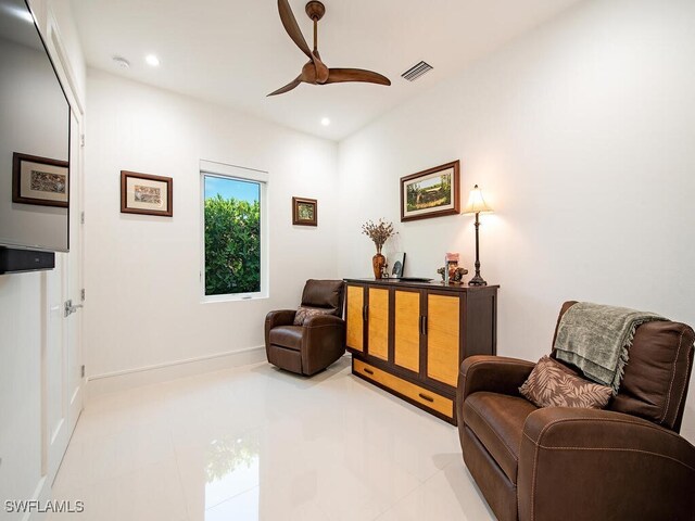 living area with ceiling fan