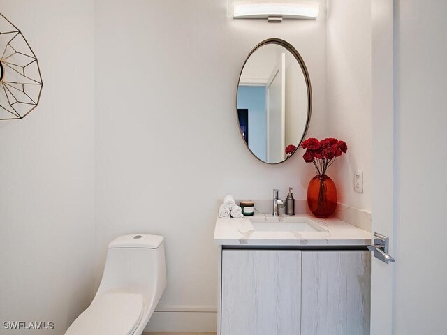 bathroom with vanity and toilet