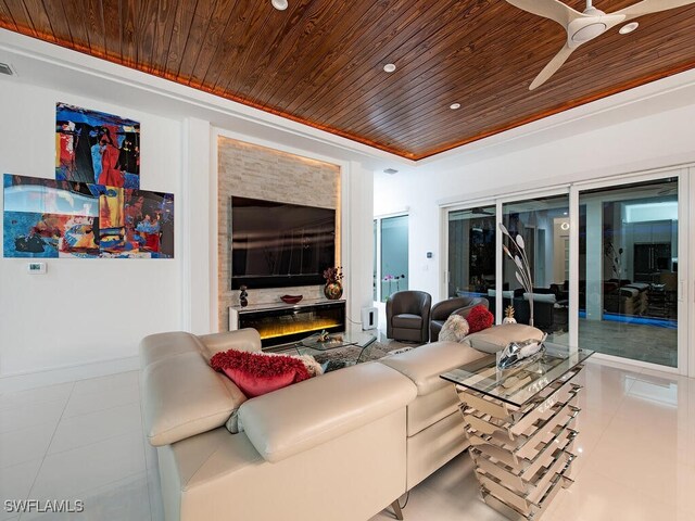 tiled living room featuring wood ceiling and a raised ceiling