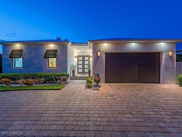 view of front of home with a garage