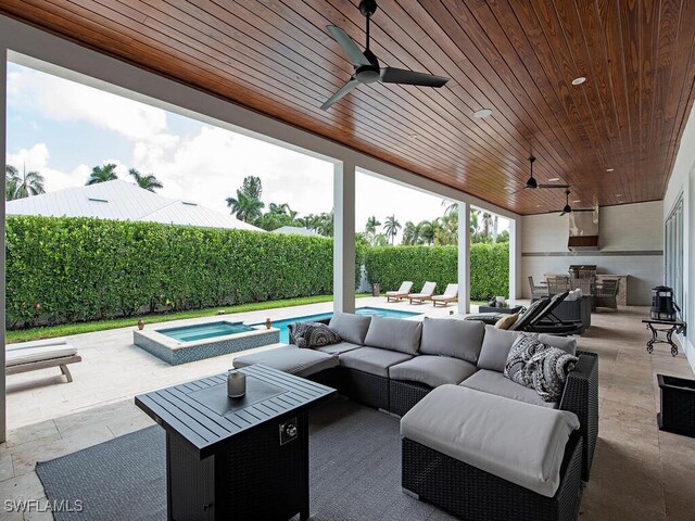 view of patio with a swimming pool with hot tub, an outdoor hangout area, and ceiling fan