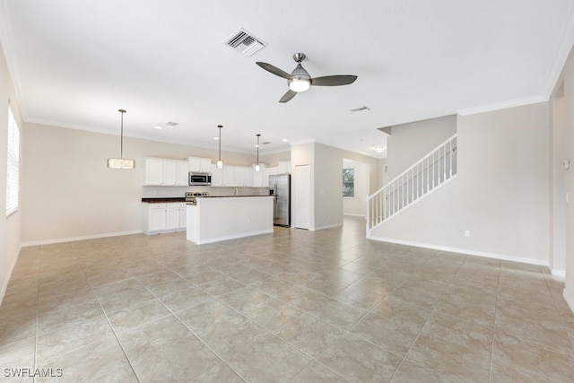 unfurnished living room featuring ceiling fan, light tile patterned flooring, and crown molding